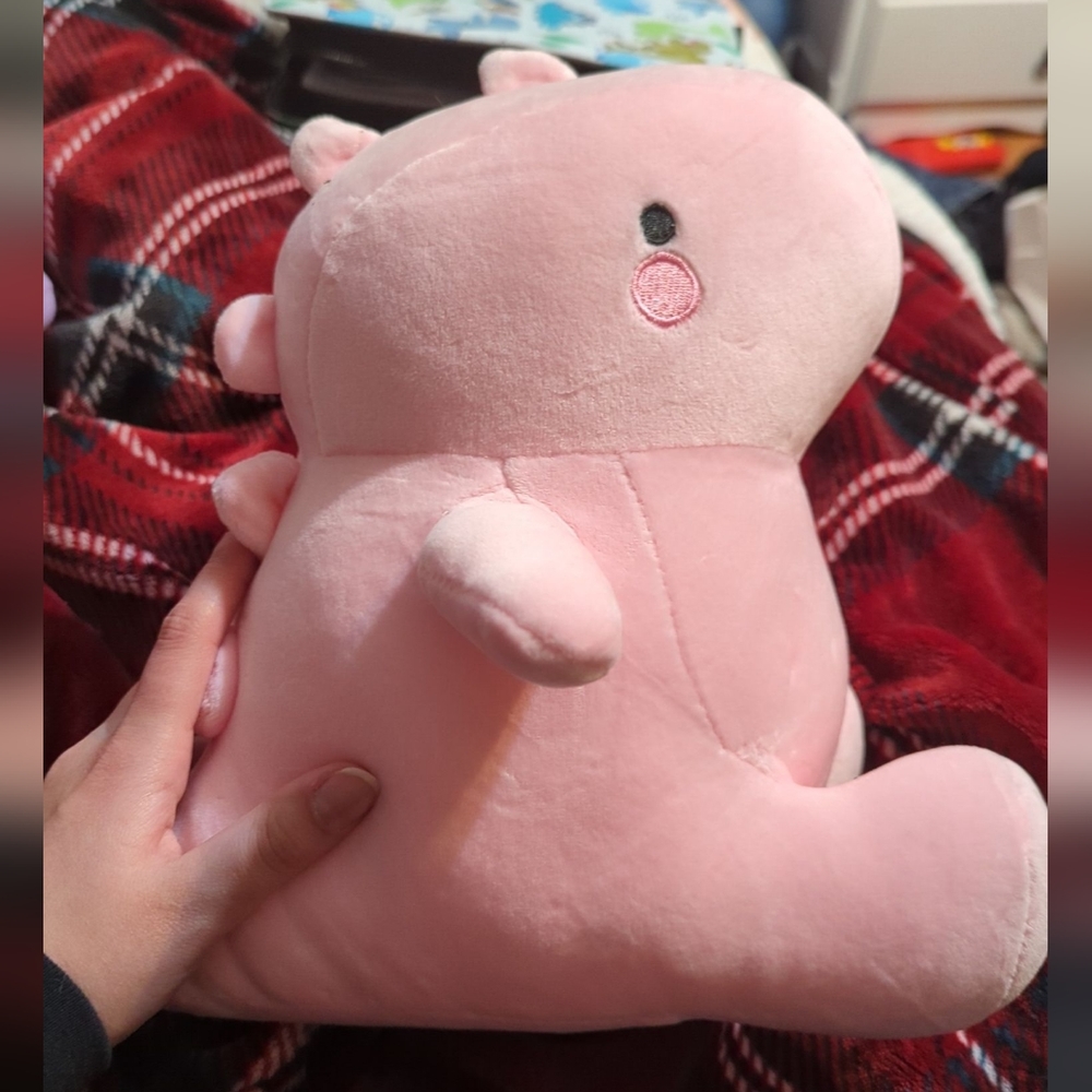 Pink dino plushie